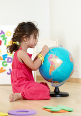 The little girl with globe