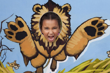 Little Girl Playing At Being A Lion