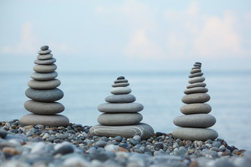 three stone stacks on pebble beach