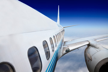 Fototapeta premium the airplane with the blue sky background.