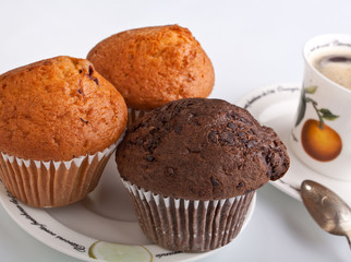 three muffins with coffee