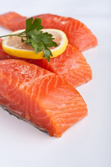 three salmon pieces on white background