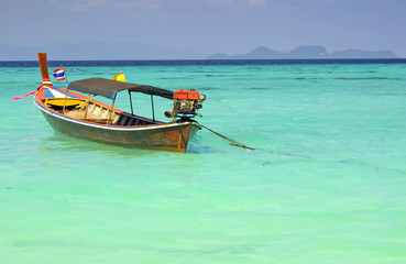 Naklejka na ściany i meble Thailand traditional longtail fish boat in Andaman sea