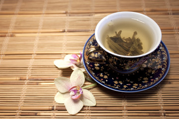 Tee cup and orchid