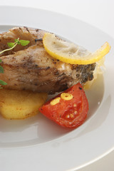 carp fillet with potato and tomato
