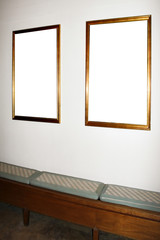 wall in museum with empty frames