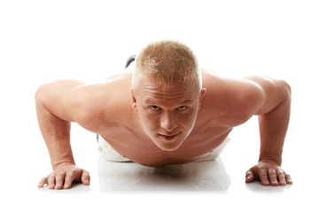 Fototapeta na wymiar Sexy muscular man exercising