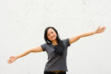 young woman with arms wide open