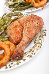 roasted chicken legs with green beans and onion rings