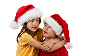 Kids wearing Santa Claus hats  isolated on white