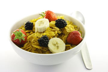 Cornflakes and Fruit in a White Bowl with Spoon