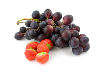 Fresh grapes and strawberry over white background