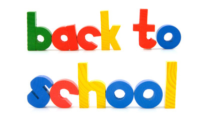sentence Back to school in wooden colorful letters