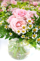 Bouquet with roses and camomiles