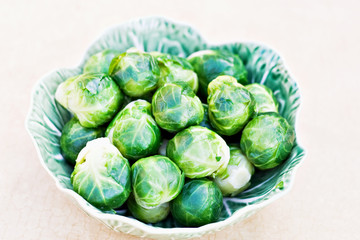 Steamed brussel sprouts in a pretty dish taken from above.