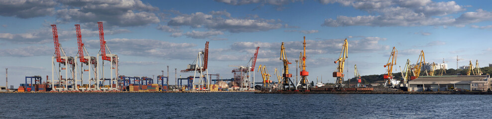 Panorama view on the port with loading cargo ship