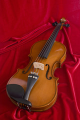 Obraz premium Violin on the red texture