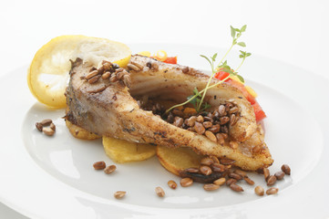 grilled carp fillet on organic potato with vegetable