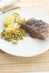 grilled pepper steak with organic potato and pea