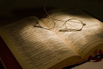 Christian Bible With Reading Glasses