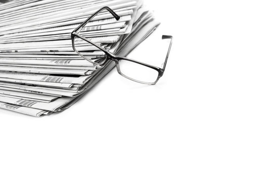 Black and white newspaper and glasses