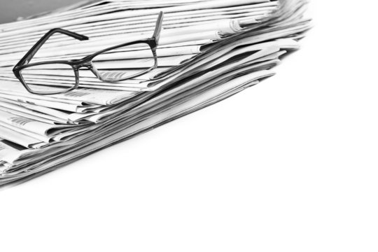 Black and white newspaper and glasses