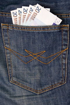 Euro money in jeans pocket