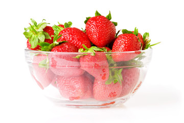 A glass bowl full of fresh strawberries.