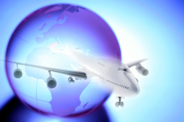 Fototapeta na wymiar World travel plane and globe