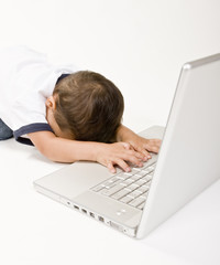 A young boy working on a laptop