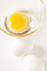 White chicken eggs and yolk