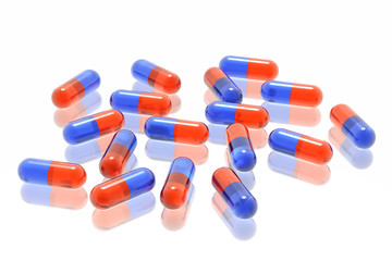 red and blue pills on white background