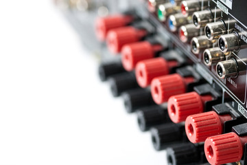Obraz premium Back of AV Receiver showing red & black speaker terminals