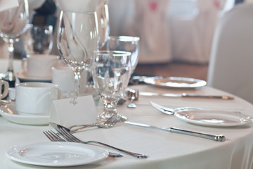 Closeup of wedding placesetting with blank placecard