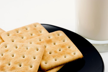 cookies on a plate and a glass of milk