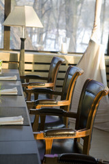 interior of restaurant. Wooden chairs and lamp