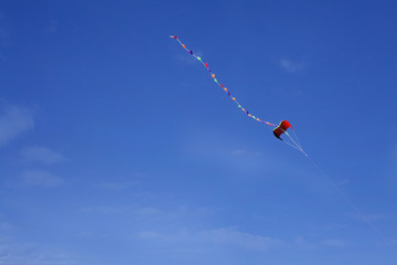 Colorful kite flying on a blue sky