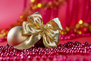 gold ribbon on red background