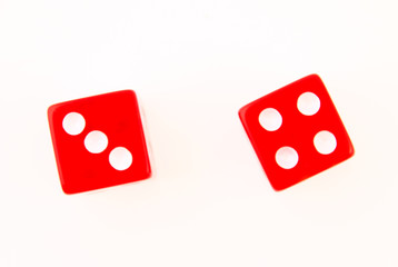2 Dice close up - showing the numbers 4 and 3 isolated