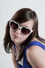 teenage girl wearing heart sunglasses