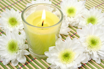 Fototapeta na wymiar Flowers and candle