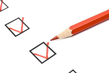 Red pencil and questionnaire