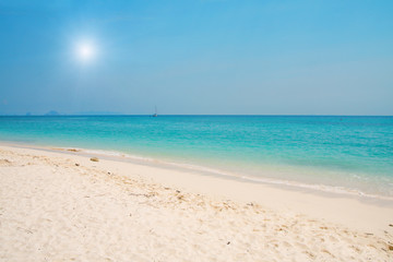 Fototapeta na wymiar beach with white sand and blue sea