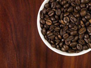 High angle view of coffee beans in a cup.