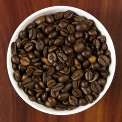 High angle view of coffee beans in a cup.