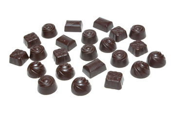 Delicious dark chocolate pralines isolated on white.