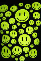Many happy smiles over black background