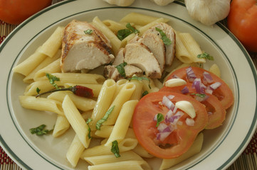 Pasta with chicken meat and organic tomato