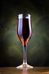 glass of red wine on the table