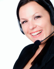 smiling brunette woman talking by headphone